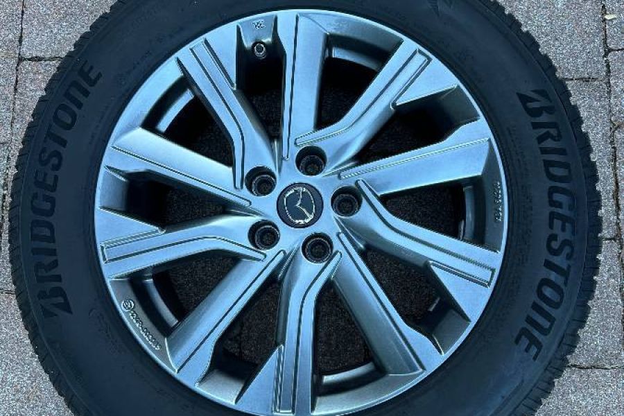 Verkaufe Winterreifen auf Felgen - Mazda - Bild 1